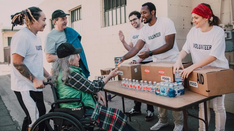Seattle community volunteers distributing food and aid to local residents, showcasing neighborhood support and inclusive development.