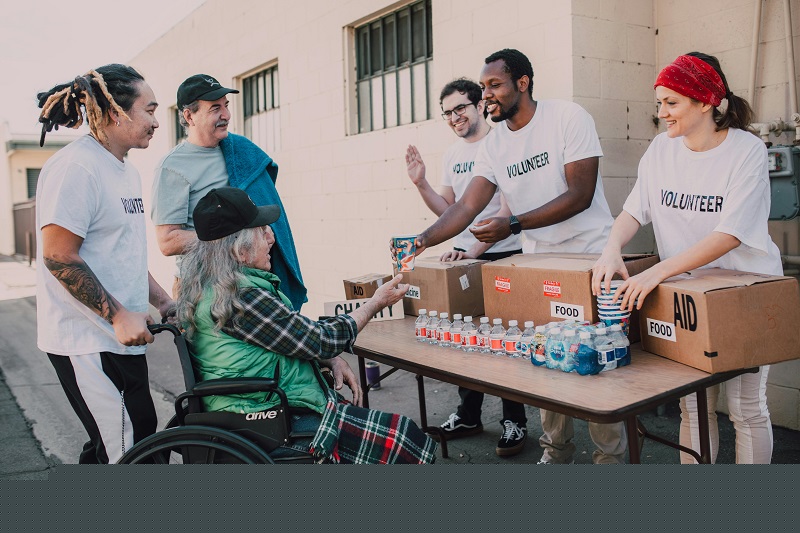 Seattle community volunteers distributing food and aid to local residents, showcasing neighborhood support and inclusive development.
